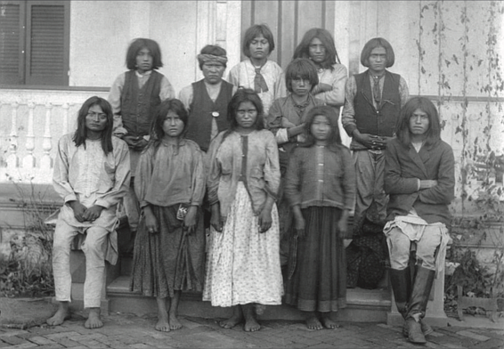 Chiricahua Apache boys and girls pose outdoors at the Carlisle Indian Industrial School in Carlisle, Penn., after their arrival from Fort Marion, Fla., in November 1886.