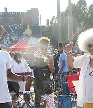 Groovin' at the 2nd Street Festival/Hundreds of people old and young came out last Saturday and Sunday for the 33rd Annual 2nd Street Festival, where music and entertainment flowed from three stages and vendors offered food, arts and other wares to festival-goers. It was the first time since the pandemic struck in 2020 that the festival returned to Jackson Ward, where streets were blocked off to traffic for the festivities. At the Waverly R. Crawley Main Stage, Dontrae Booker of Richmond, left, and Alice Brown of Henrico groove to the sounds of DJ Drake and MC Choco.