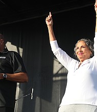 Groovin' at the 2nd Street Festival/Alfred C. Liggins III, chief executive officer of the Silver Spring-based Urban One, and his mother, Cathy Hughes, founder and chairperson of Urban One, talk from the main stage about public support for their company’s planned $565 million ONE Casino + Resort project in South Richmond that is up for city voter approval on the Nov. 2 ballot. Urban One was one of the many partner organizations sponsoring the festival, which was presented by Venture Richmond, a Downtown booster nonprofit.