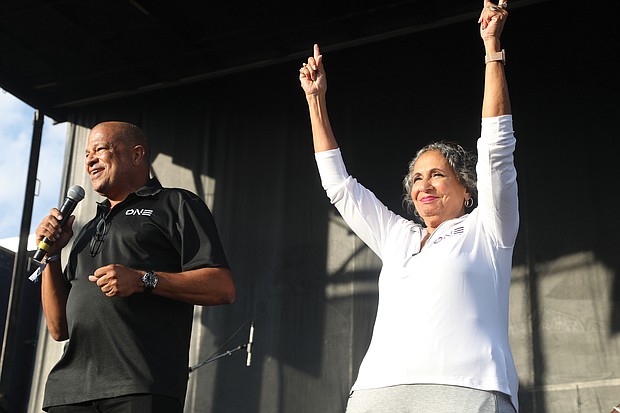 Groovin' at the 2nd Street Festival/Alfred C. Liggins III, chief executive officer of the Silver Spring-based Urban One, and his mother, Cathy Hughes, founder and chairperson of Urban One, talk from the main stage about public support for their company’s planned $565 million ONE Casino + Resort project in South Richmond that is up for city voter approval on the Nov. 2 ballot. Urban One was one of the many partner organizations sponsoring the festival, which was presented by Venture Richmond, a Downtown booster nonprofit.