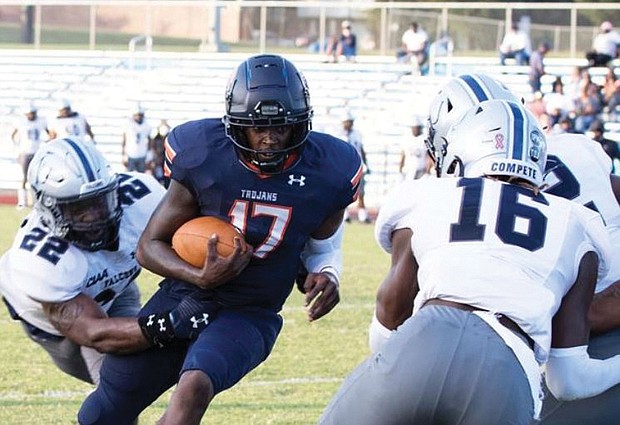 Virginia State University quarterback D’Vonte Waller runs with the ball to gain yardage last Saturday in the Trojans’ 33-9 win over St. Augustine’s University at Rogers Stadium in Ettrick.