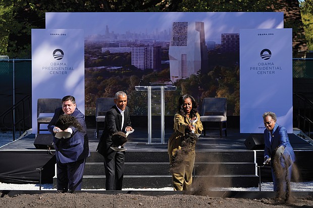 Former President Obama and former First Lady Michelle Obama use shovels to ceremonially break ground Tuesday to officially kick off construction of the Obama Presidental Center in Jackson Park on Chicago’s South Side. They are joined by Illinois Gov. J.B. Pritzker, left, and Chicago Mayor Lori Lightfoot, right.