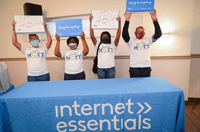 Comcast began a week-long tour across Illinois promoting digital equity. The Internet Essentials initiative celebrates its 10th year anniversary, providing low-cost broadband for low-income households. The tour kicked off with its first stop to the village of Dolton where students were presented with laptops. Photo provided by Comcast.