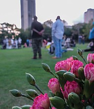 Roses adorn the African Burial Ground in Shockoe Bottom where the enslaved man Gabriel was hanged Oct. 10, 1800, for plotting an rebellion against his enslavers.