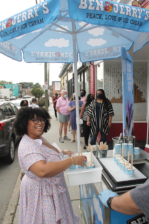 Queen of ice cream Rabia Kamara gives out samples of her winning Ben & Jerry’s ice cream creation “Bia’s Black Joy Sundae” last week to people lined up outside her shop, Ruby Scoops Ice Cream & Sweets, on Brookland Park Boulevard.