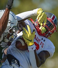 Andre Greene Jr. of St. Christopher’s snags the ball during the team’s game against Benedictine College Preparatory on Oct. 1.The 6-foot-3 Greene, a senior, has six colleges at the top of his list and offers from across the country.