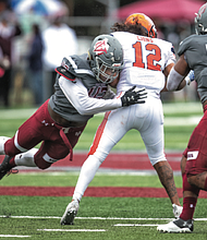 Virginia Union University’s Xzavier Hines catapults in to sack Lincoln University quarterback Trae Greene in last Saturday’s homecoming game. The Panthers sacked the Lincoln quarterback nine times during their 32-0 victory.