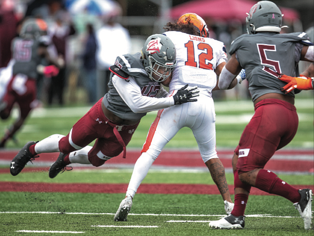 Virginia Union University’s Xzavier Hines catapults in to sack Lincoln University quarterback Trae Greene in last Saturday’s homecoming game. The Panthers sacked the Lincoln quarterback nine times during their 32-0 victory.