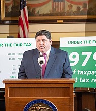 Gov. JB Pritzker is pictured in his Capitol office in 2019 during a news conference promoting the graduated income tax, which voters rejected last year. His campaign released his 2020 income taxes Friday. Capitol News Illinois file photo