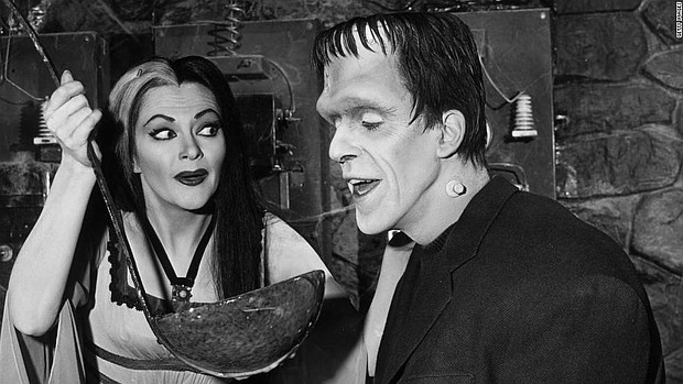 Lily Munster (Yvonne De Carlo) holds a giant ladle for Herman Munster (Fred Gwynne) in an episode of the original "The Munsters."
Mandatory Credit:	Getty Images
