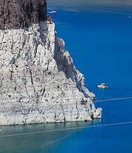 Vice President Kamala Harris will visit Lake Mead in Nevada on Monday. A boater gets an up-close view the "bathtub ring" that is visible at low water levels of Lake Mead and is the result of the deposition of minerals on previously submerged surfaces while touring the front of Hoover Dam, which sits on the border of Nevada and Arizona.
Mandatory Credit:	Allen J. Schaben/Los Angeles Times/Shutterstock