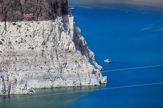 Vice President Kamala Harris will visit Lake Mead in Nevada on Monday. A boater gets an up-close view the "bathtub ring" that is visible at low water levels of Lake Mead and is the result of the deposition of minerals on previously submerged surfaces while touring the front of Hoover Dam, which sits on the border of Nevada and Arizona.
Mandatory Credit:	Allen J. Schaben/Los Angeles Times/Shutterstock