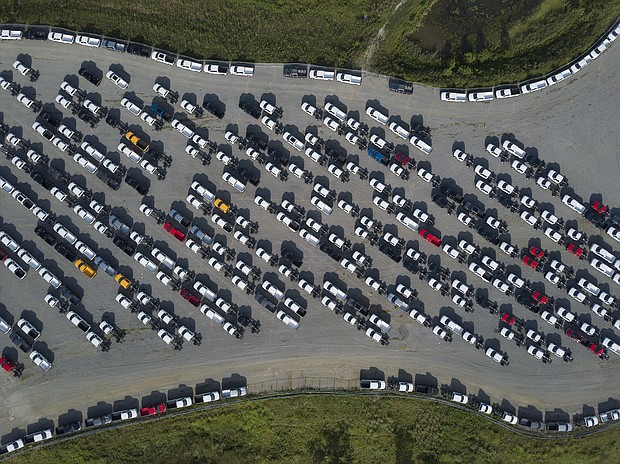 America's factories have struggled with shortages of materials and qualified workers. New Ford F-Series pickup trucks are shown here stored in a lot during a semiconductor shortage at Kentucky Speedway in Sparta, Kentucky, U.S., on Friday, July 16, 2021.
Mandatory Credit:	Jeffrey Scott Dean/Bloomberg/Getty Images