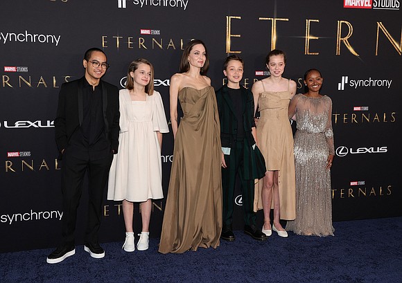 Angelina Jolie and most of her children recycled some old looks for a new movie premiere.