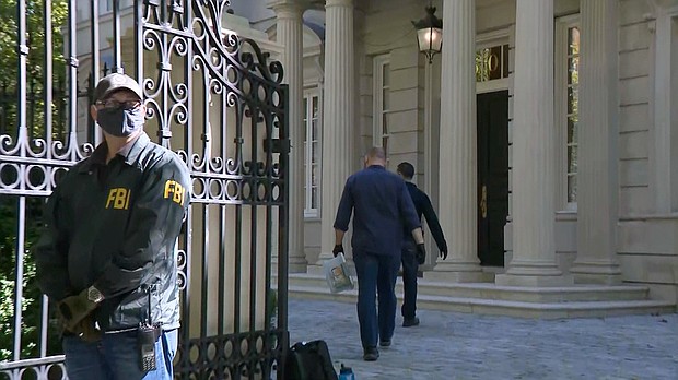 FBI agents are shown here at the Washington home of Russian oligarch Oleg Deripaska.
Mandatory Credit: CNN