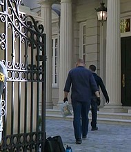 FBI agents are shown here at the Washington home of Russian oligarch Oleg Deripaska.
Mandatory Credit:	CNN