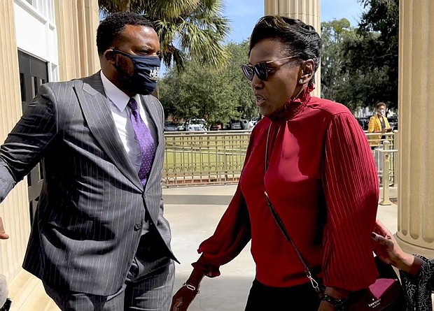 Ahmaud Arbery’s mother Wanda Cooper-Jones heads into the Glynn County Courthouse in Brunswick, Ga whith her attorney attorney Lee Meritt
(AP Photo/Lewis M. Levine)
