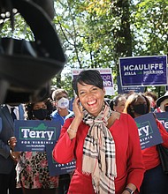 During a “Souls to the Polls” event last Sunday outside the Richmond Voter Registrar’s Office, Atlanta Mayor Keisha Lance Bottoms pauses for an interview with a national television news program to talk about why she made the 500-mile trip to campaign for Terry McAuliffe. The City of Richmond and Hanover County had polling stations open last Sunday for early, in-person voting.