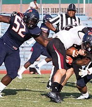 The Virginia State University defense scrambles to keep the Bowie State University ball carrier from making much headway in last Saturday’s game. VSU ultimately lost to the perennial powerhouse 51-44.