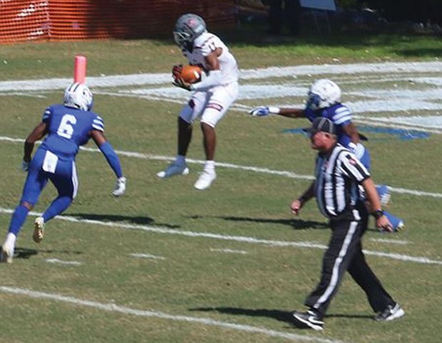 Virginia Union University wide receiver Larry Hackey goes high for a reception during last Saturday’s game against Chowan University in Murfreesboro, N.C.