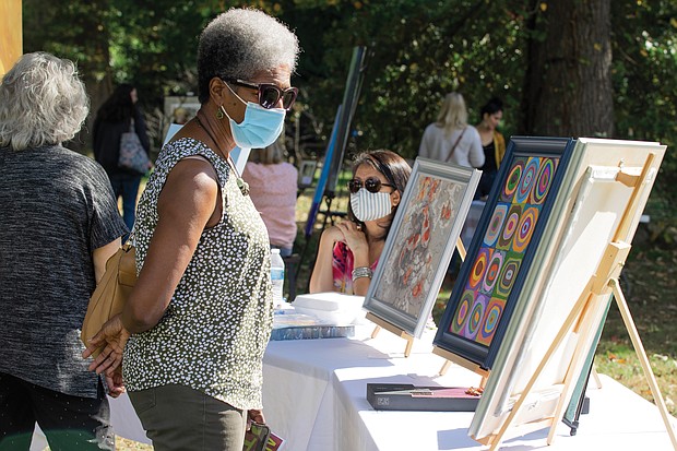 Art and music flourished outdoors last Saturday at the 2nd Annual Art Under the Pines, a free exhibition of local artists, held in the Sculpture Garden of Pine Camp Cultural Arts and Community Center in North Side. Vashti Woods finds the weather perfect for browsing, buying and enjoying art of all types.