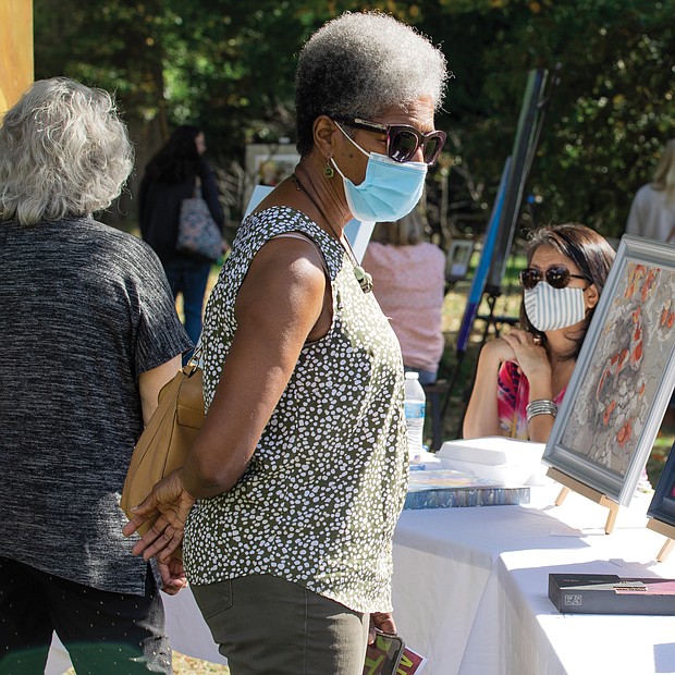 Art and music flourished outdoors last Saturday at the 2nd Annual Art Under the Pines, a free exhibition of local artists, held in the Sculpture Garden of Pine Camp Cultural Arts and Community Center in North Side. Vashti Woods finds the weather perfect for browsing, buying and enjoying art of all types.