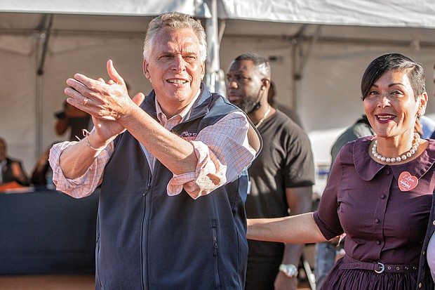 Politics also was a part of the mix with Democratic gubernatorial candidate Terry McAuliffe, a former governor, and his running mate, Delegate Hala Ayala, who is running for lieutenant governor, greeting people as they moved through the crowd.