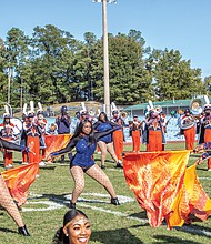 The band’s flag bearers and the Woo Woos, the university’s noted cheerleading squad, showed off their moves and kept the homecoming spirit going.