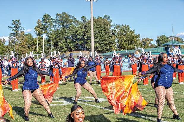 The band’s flag bearers and the Woo Woos, the university’s noted cheerleading squad, showed off their moves and kept the homecoming spirit going.