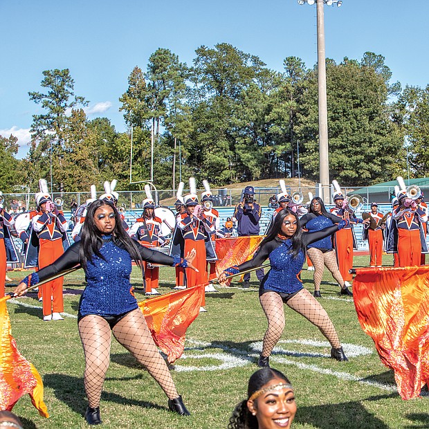 The band’s flag bearers and the Woo Woos, the university’s noted cheerleading squad, showed off their moves and kept the homecoming spirit going.