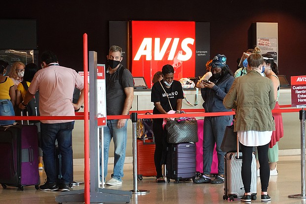 People wait in line at Avis rental agency in the Miami International Airport Car Rental Center on April 12, 2021 in Miami, Florida. Customers are finding that car rental agencies have limited or no supply of vehicles as people begin traveling again after being locked down during the pandemic.
Mandatory Credit: Joe Raedle/Getty Images