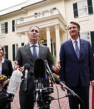 Gov. Ralph S. Northam, second from left, speaks to the media as Gov.-elect Glenn A. Youngkin and his wife, Suzanne, right, and First Lady Pam Northam listen after a luncheon Nov. 4 at the Governor’s Mansion in Capitol Square in Downtown.