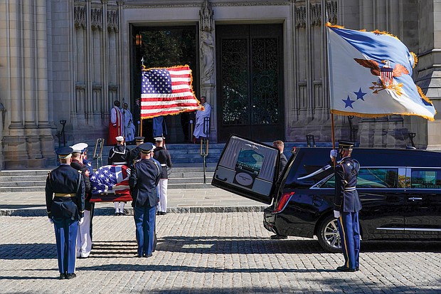 The flag-draped casket of former Gen. Colin Powell, a former head of the Joint Chiefs of Staff and U.S. secretary of state, is carried by a military honor guard into the Washington National Cathedral for a funeral service on Nov. 5.