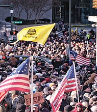 In this file photo from Jan. 20, 2020, thousands of demonstrators crowd Bank Street in Downtown, waving flags and signs during the Lobby Day rally by gun rights activists at the State Capitol on the Martin Luther King Jr. Holiday. Patrik Jordan Mathews and Brian Mark Lemley Jr. were sentenced Oct. 28 in federal court in connection with plans to commit violence at the rally.