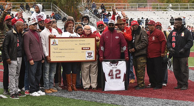 It was William “Dil” Dillon Day at Virginia Union University last Saturday during the Panthers’ annual gridiron clash with the Trojans of Virginia State University.
During halftime of the game at VUU’s Hovey Stadium, family members, former teammates and fellow members of Kappa Alpha Psi Fraternity participate in a ceremony to officially retire the No. 42 jersey that the late Mr. Dillon wore as a VUU player from 1979 to 1982.
The fraternity’s Alpha Gamma Chapter also donated $50,000 to the VUU football team during the ceremony.
Mr. Dillon, a Detroit native who later won plaudits as a local softball player and high school basketball official before his death in 2017 at age 59, was recognized and remembered for his remarkable playing career.
As recounted during the ceremony, Mr. Dillon was a star defender for the Panthers under Coach Willard Bailey. During his VUU career, he picked off 30 opponents’ passes, including 16 during his sophomore season. He was selected three years in a row as an Associated Press Little All-American while helping VUU earn four straight invitations to the NCAA Division II football tournament.
