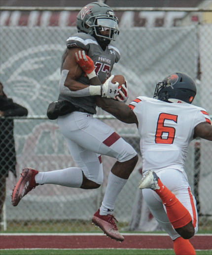 Virginia Union University wide receiver Charles Hall snags a pass over the arm of Virginia State University’s Vincent Parker at Hovey Stadium last Saturday during the final game of the season for both teams.