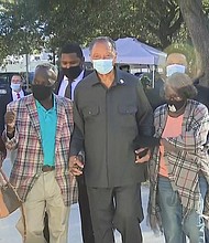 Noted civil rights leader the Rev. Jesse Jackson arrives at Monday's court proceedings in a show of support for the Arbery family.
Mandatory Credit:	CNN
Dateline:	Brunswick, Georgia, US