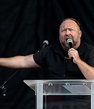 Sandy Hook families suing InfoWars founder Alex Jones have won a case against him after a judge ruled against Jones who has failed to comply with the discovery process. Jones is shown here speaking to supporters of US President Donald Trump as they demonstrate in Washington, DC, on December 12, 2020, to protest the 2020 election.
Mandatory Credit: Olivier Douliery/AFP/Getty Images