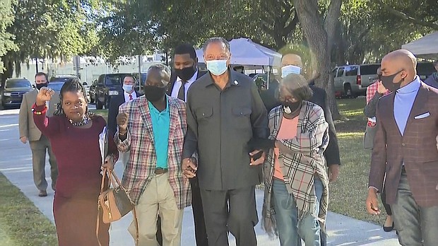 Noted civil rights leader the Rev. Jesse Jackson arrives at Monday's court proceedings in a show of support for the Arbery family.
Mandatory Credit:	CNN