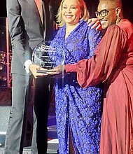 Connie Lindsey poses with her award with Michael O’Grady President and CEO of Northern Trust and Karen Freeman-Wilson, President and CEO of the Chicago Urban League.