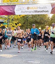 More than 14,000 runners participated in this year’s Richmond Marathon, which featured a full 26.2 mile marathon, a half marathon of 13.1 miles and an 8K race. Here, runners cross the starting line at 5th and Grace streets in Downtown last Saturday.