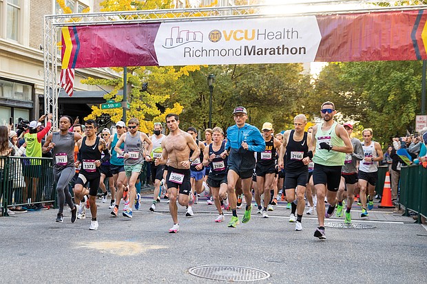 More than 14,000 runners participated in this year’s Richmond Marathon, which featured a full 26.2 mile marathon, a half marathon of 13.1 miles and an 8K race. Here, runners cross the starting line at 5th and Grace streets in Downtown last Saturday.