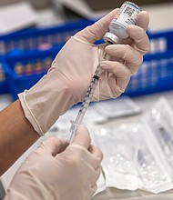 Dr. Anthony Fauci told CNN, If you and your family members are fully vaccinated against Covid-19, it's OK for you to ditch the masks this holiday season when you're around each other.
Mandatory Credit:	Francine Orr/Los Angeles Times/Getty Images