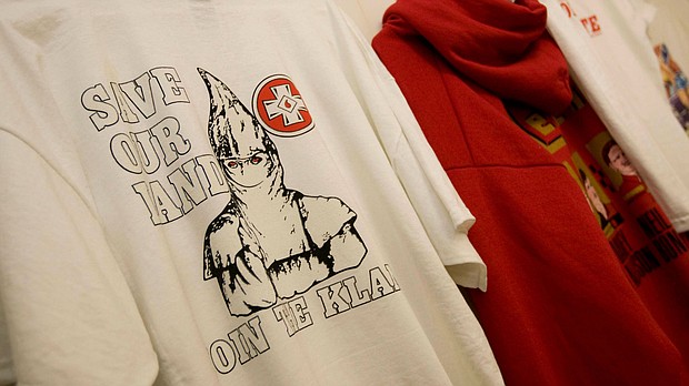 A T-shirt with the words "Save Our Land Join The Klan" inside the Redneck Shop.
Mandatory Credit: Patrick Collard/AP