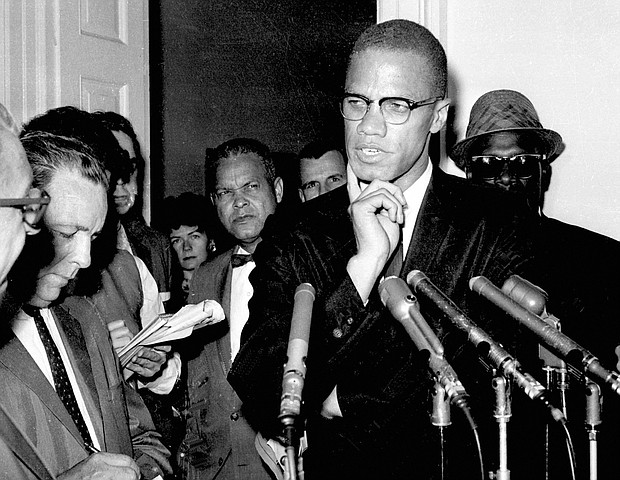 Malcolm X speaks to reporters on May 16, 1963, in Washington, D.C.