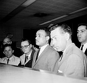 Khalil Islam, second from right, is booked on March 3, 1965, in the slaying of Malcolm X in New York on Feb. 21, 1965. Mr. Islam, who is being held by Detective John Keeley, right, died in 2009 after serving more than a decade in prison. He was paroled in the 1980s.