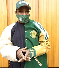 Howard Hopkins, former coach, teacher and principal with Richmond Public Schools, shows off his
athletic jacket with the colors of both Armstrong High School and Maggie L. Walker High School that he said is a “representation of unity.” Mr. Hopkins is on the organizing committee of the Armstrong-Walker Classic Legacy parade and football game that is taking place Saturday, Nov. 27.