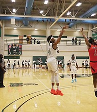 University of Mount Olive’s Jeremiah Phifer jumps and shoots over Virginia State University’s Dajour Rucker Nov. 19 in the Pickle Classic. VSU beat Mount Olive 99-95, and then lost on Nov. 20 to Barton College 105-90 in the second matchup of the classic.