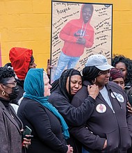 Family members of Rah’quan Logan mourn during a gathering Sunday to remember and honor the 14- year-old’s life held outside the OMG Convenience Store at Creighton and Nine Mile Roads where he was gunned down Nov. 12 in a quadruple shooting. Nine-year-old Abdul bani-Ahmad, whose family owns the store, also was killed, while two men were wounded. More than 100 people attended the vigil, including City Council President Cynthia I. Newbille and Richmond School board Chairwoman Cheryl L. Burke. Many brought silver and black balloons to honor Rah’quan. James “J.J.” Minor III, president of the Richmond branch NAACP, called on parents and others to stop the violence and asked faith-based organizations to provide support for families. Rah’quan’s funeral was held Tuesday morning at Walter J. Manning Funeral Home in Church Hill with burial in Oakwood Cemetery.