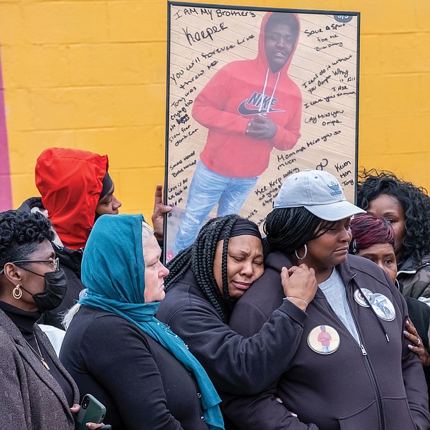 Family members of Rah’quan Logan mourn during a gathering Sunday to remember and honor the 14- year-old’s life held outside the OMG Convenience Store at Creighton and Nine Mile Roads where he was gunned down Nov. 12 in a quadruple shooting. Nine-year-old Abdul bani-Ahmad, whose family owns the store, also was killed, while two men were wounded. More than 100 people attended the vigil, including City Council President Cynthia I. Newbille and Richmond School board Chairwoman Cheryl L. Burke. Many brought silver and black balloons to honor Rah’quan. James “J.J.” Minor III, president of the Richmond branch NAACP, called on parents and others to stop the violence and asked faith-based organizations to provide support for families. Rah’quan’s funeral was held Tuesday morning at Walter J. Manning Funeral Home in Church Hill with burial in Oakwood Cemetery.